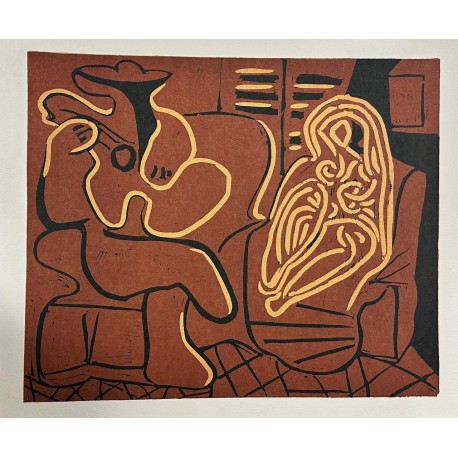 FEMME DANS UN FAUTEUIL ET GUITARISTE